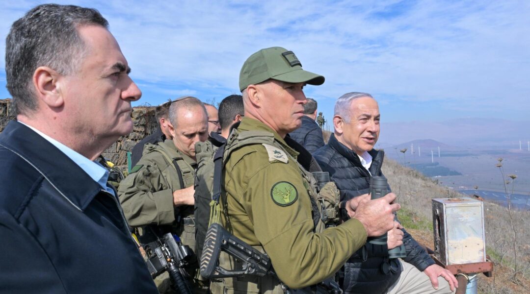 Israeli Prime Minister Benjamin Netanyahu (right) and other Israeli officials at the Syrian border on Dec. 8, 2024. (Koby Gideon/Israeli Government Press Office)