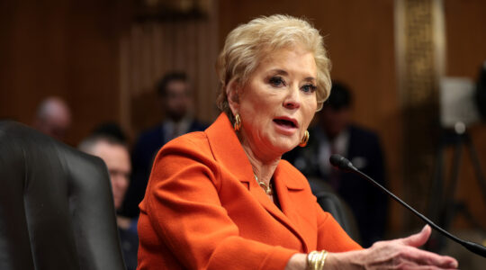 A woman at a podium during a Senate hearing