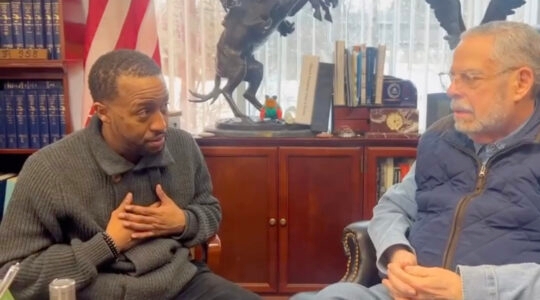 Two men talking in an attorney's office