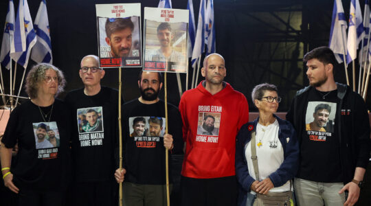 Freed Israeli hostages Aviva Siegel, Keith Siegel, Yarden Bibas, Yair Horn, Yocheved Lifshitz and Sasha Trufanov hold a protest calling for the end of the war and the release of the remaining Israeli hostages held captive in Gaza in Tel Aviv's Hostages Square, March 18, 2025. (Gil Cohen-Magen/AFP via Getty Images)